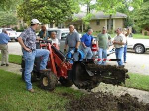 Our Flower Mound irrigation team takes a break from trenching a new line